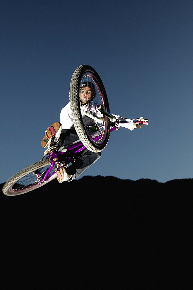 Mountain biker jumping, Oberammergau, Bavaria, Germany