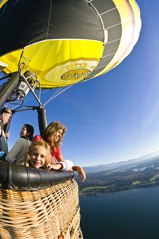 People enjoying a ride on a on hot air balloon, Upper Bavaria, Bavaria, Germany