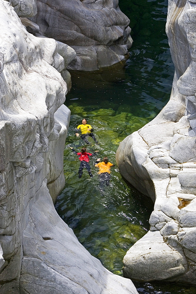 Young woman canyoning, Valle Maggia, Canton of Ticino, Switzerland, MR