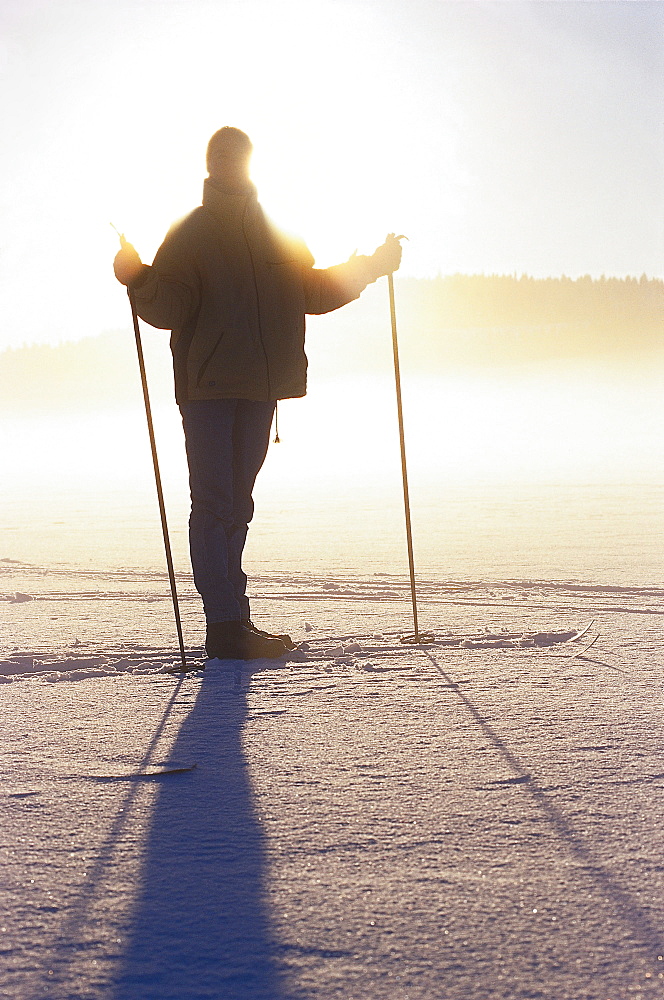 Cross country skiing on snow, descending fog, Vastergotland, Sweden