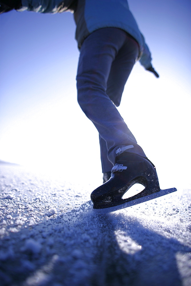 Young woman ice skating