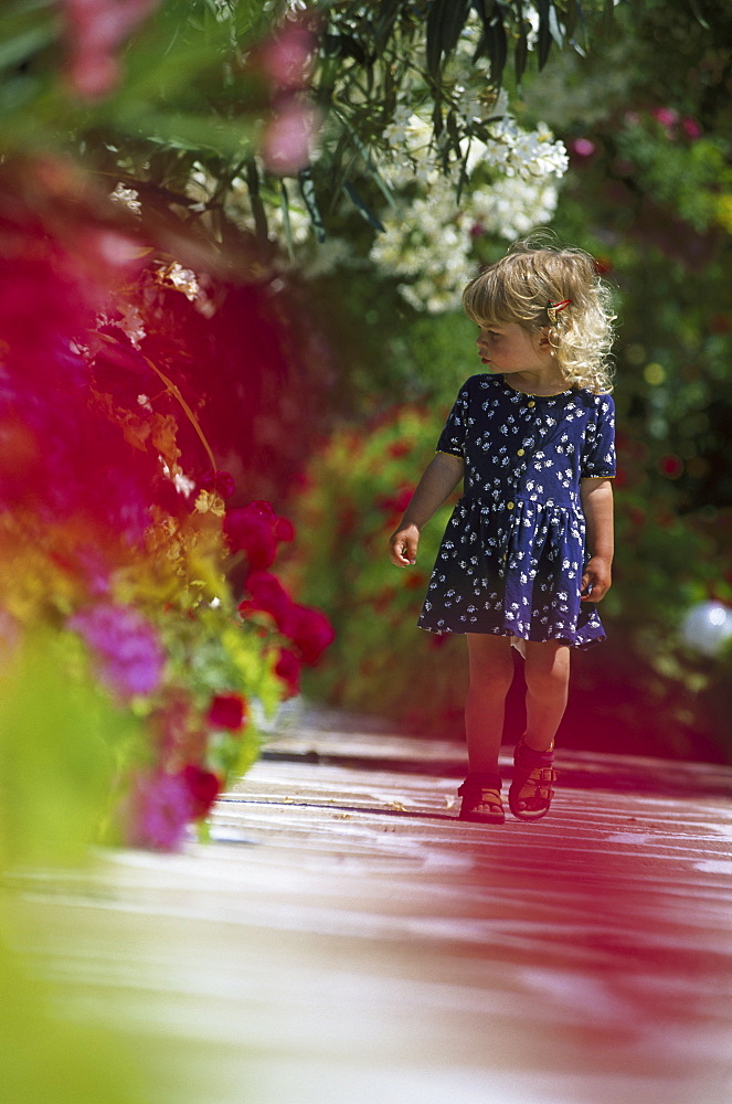 Little girl walking on trail