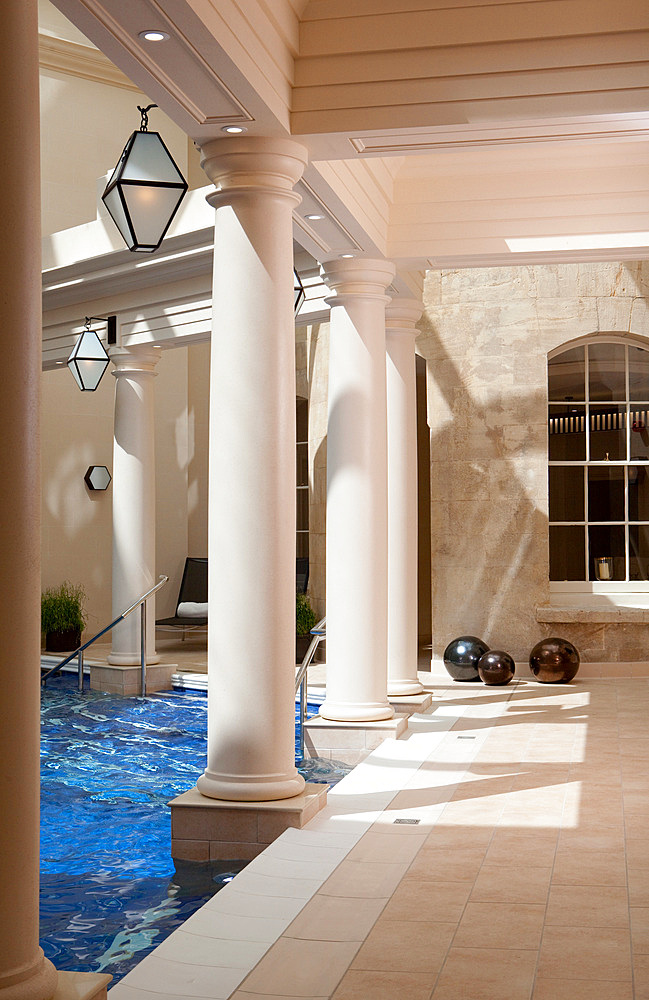 Daylight shot of streaks of light on columns inside an interior poolroom, Bath, United Kingdom