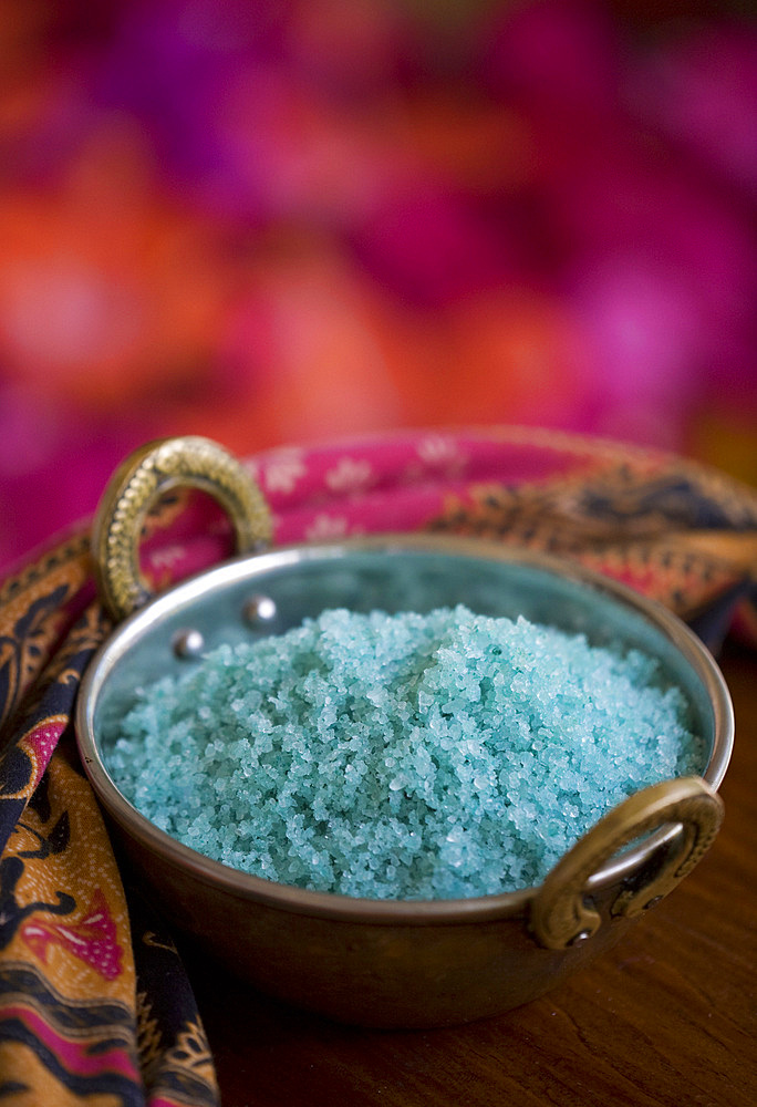 Detail shot of a bowl blue salt for spa treatments. St. Lucia, West Indies.