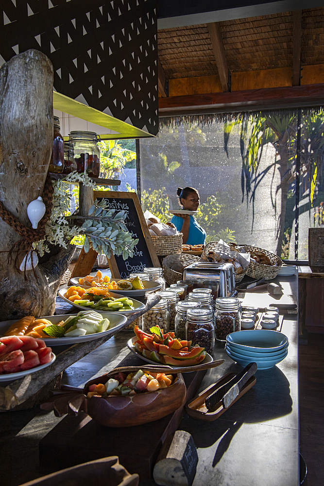 Waitress behind a fantastic breakfast buffet in the Tovolea Restaurant of the Six Senses Fiji Resort, Malolo Island, Mamanuca Group, Fiji Islands, South Pacific