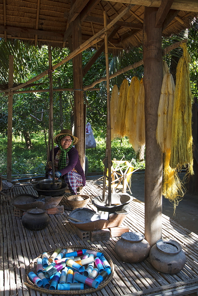 Woman weaves silk on loom in a silk factory, Oknha Tey Island, Mekong River, near Phnom Penh, Cambodia, Asia