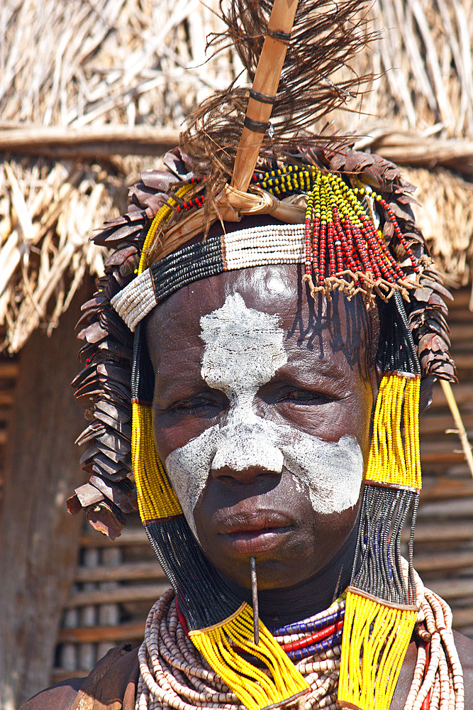 Ethiopia; Southern Nations Region; southern Ethiopian highlands; Kolcho village on the Omo River; Karo woman with headdress and face-paint;