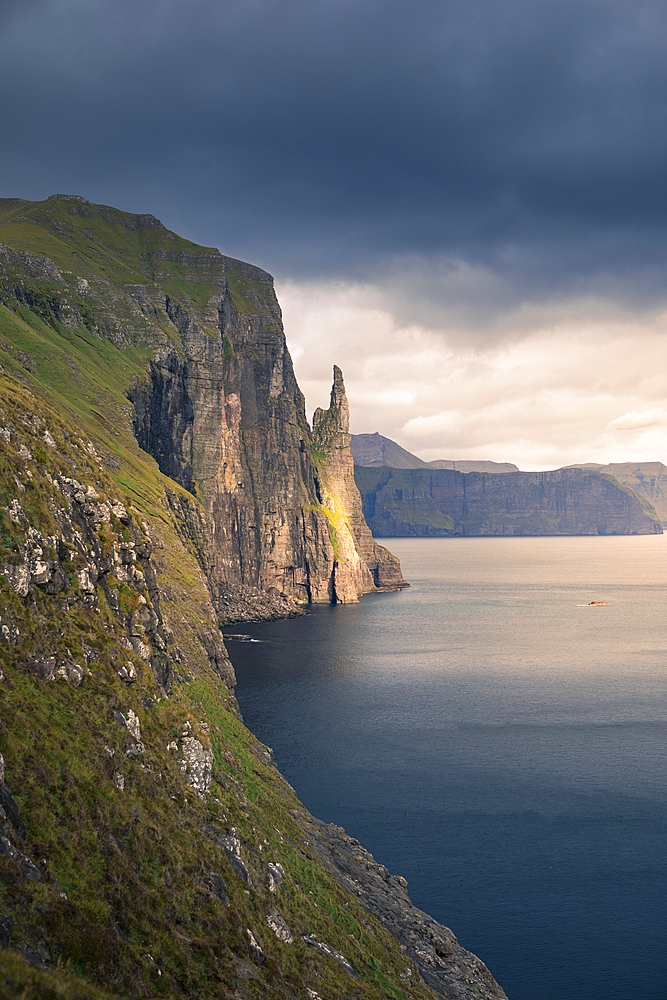 Trøllkonufingur Hexenfinger rock formation at sunset on Vagar Island, Faroe Islands