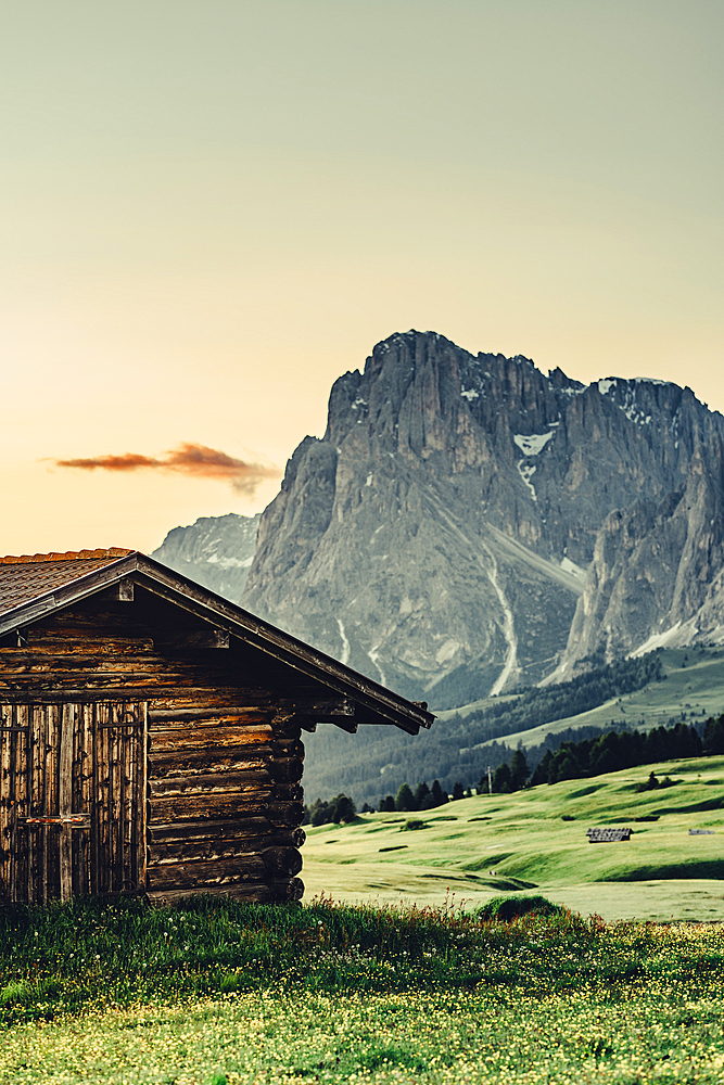 Hut at sunrise on the Seiser Alm in South Tyrol, Italy, Europe;