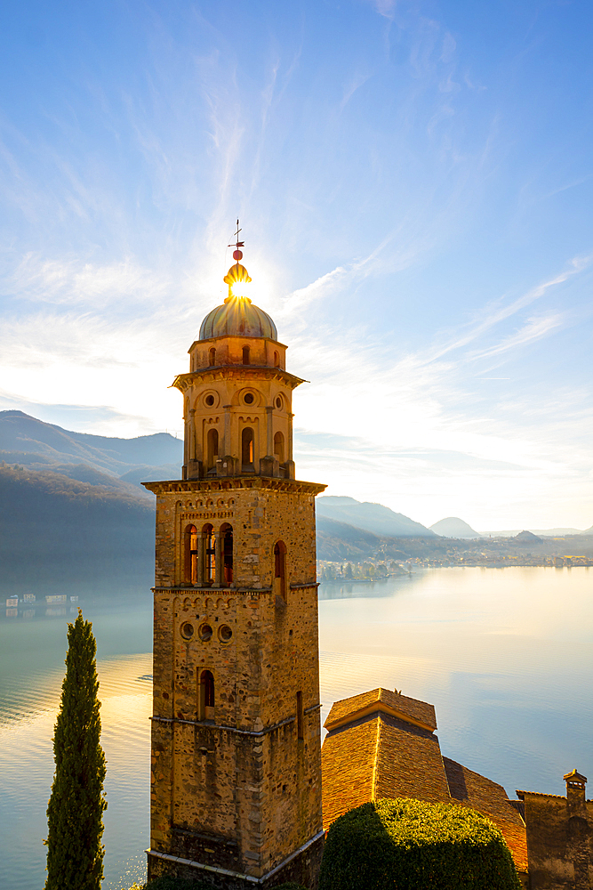 Church Tower Santa Maria del Sasso with Sunlight and Mountain on Lake Lugano in Morcote, Ticino in Switzerland.