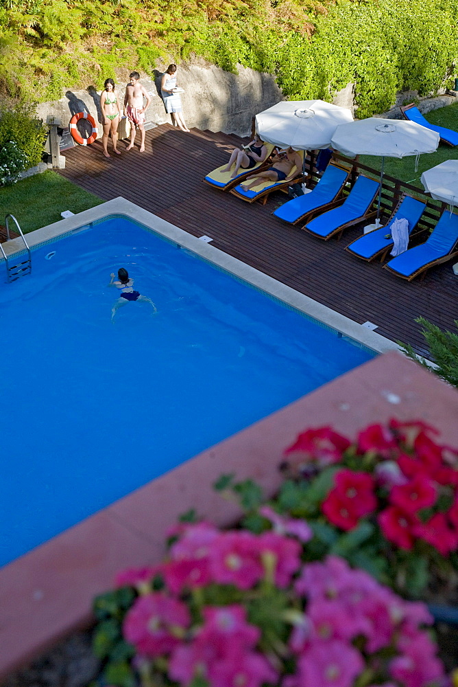 Guests in the outdoor swimming pool, Caldas de Monchique, hot springs and wellness resort, Monchique, Algarve, Portugal