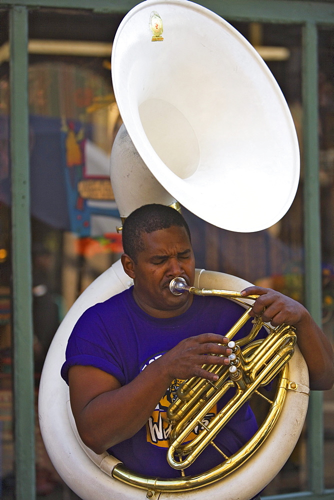 Man playing a sousaphone, a type of tuba, French Quarter, New Orleans, Louisiana, USA