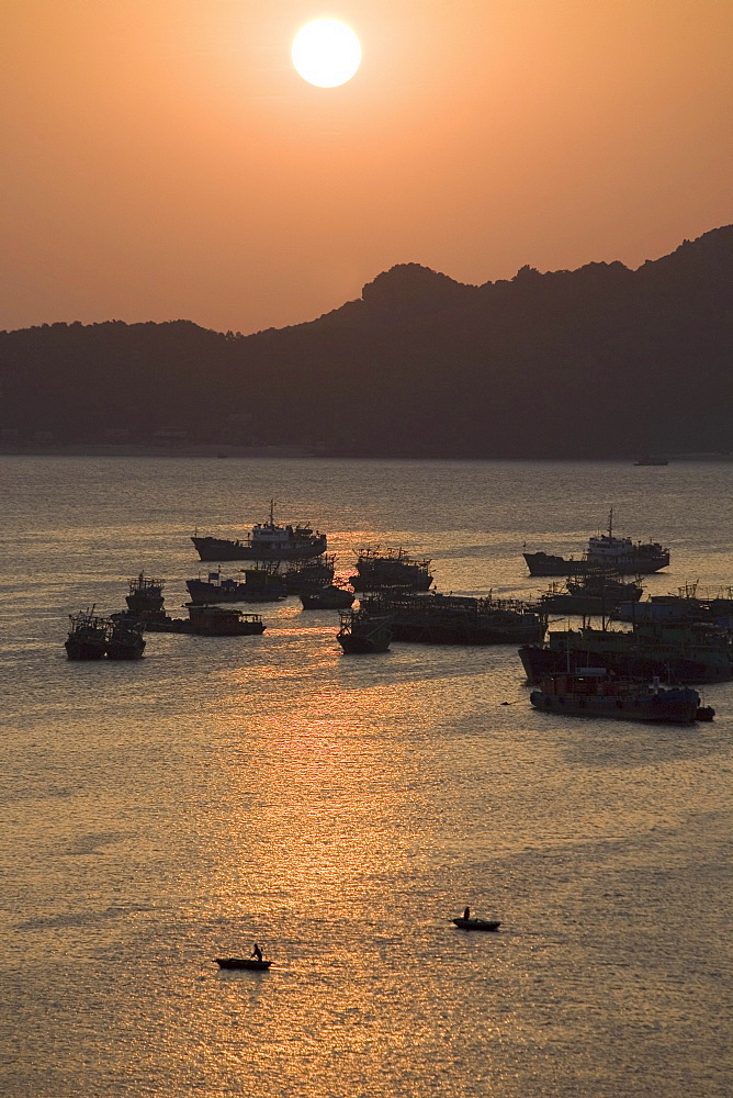 Sunset over the harbour of Cat-Ba Town, Halong Bay at the Gulf of Tonkin, Vietnam, Asia