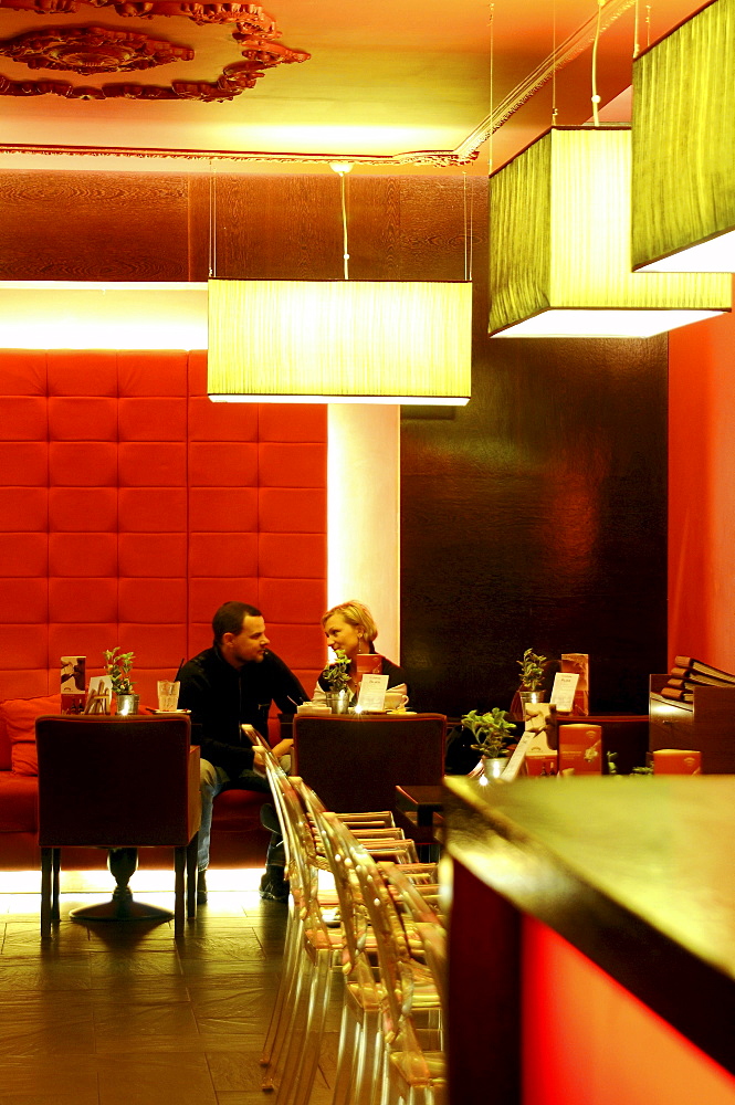 A couple sitting at a table at cafe Felber, Gdansk, Poland, Europe