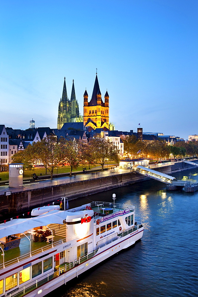 View over river Rhine to old town with cathedral and Great St. Martin church, Cologne, North Rhine-Westphalia, Germany