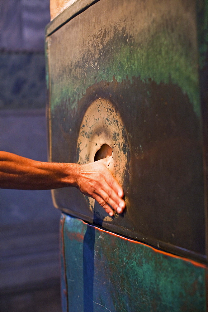 mythical sweating column of pourous marble, place the thumb in the hole and make a wish, Istanbul, Turkey