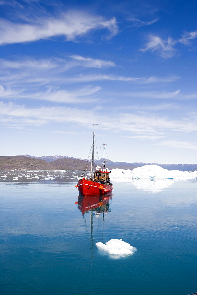 Fishing boat on sightseeing tour in front of icebergs at Qooroq Fjord, Narsarsuaq, Kitaa, Greenland