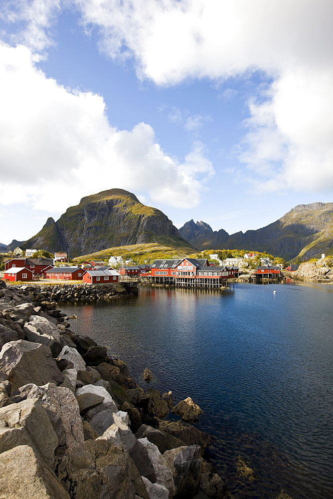 Rorbu huts on the waterfront under clouded sky, Lofoten, Norway, Scandinavia, Europe