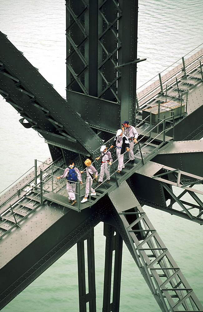 People climbing on the steel beam of the Harbour Bridge, Sydney, New South Wales, Australia