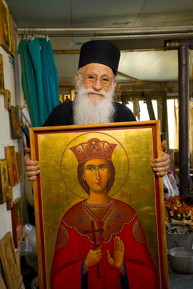 Icon painter Father Kallinikos holding a painting, icon, Stravrovouni monastery, Larnaka, South Cyprus, Cyprus