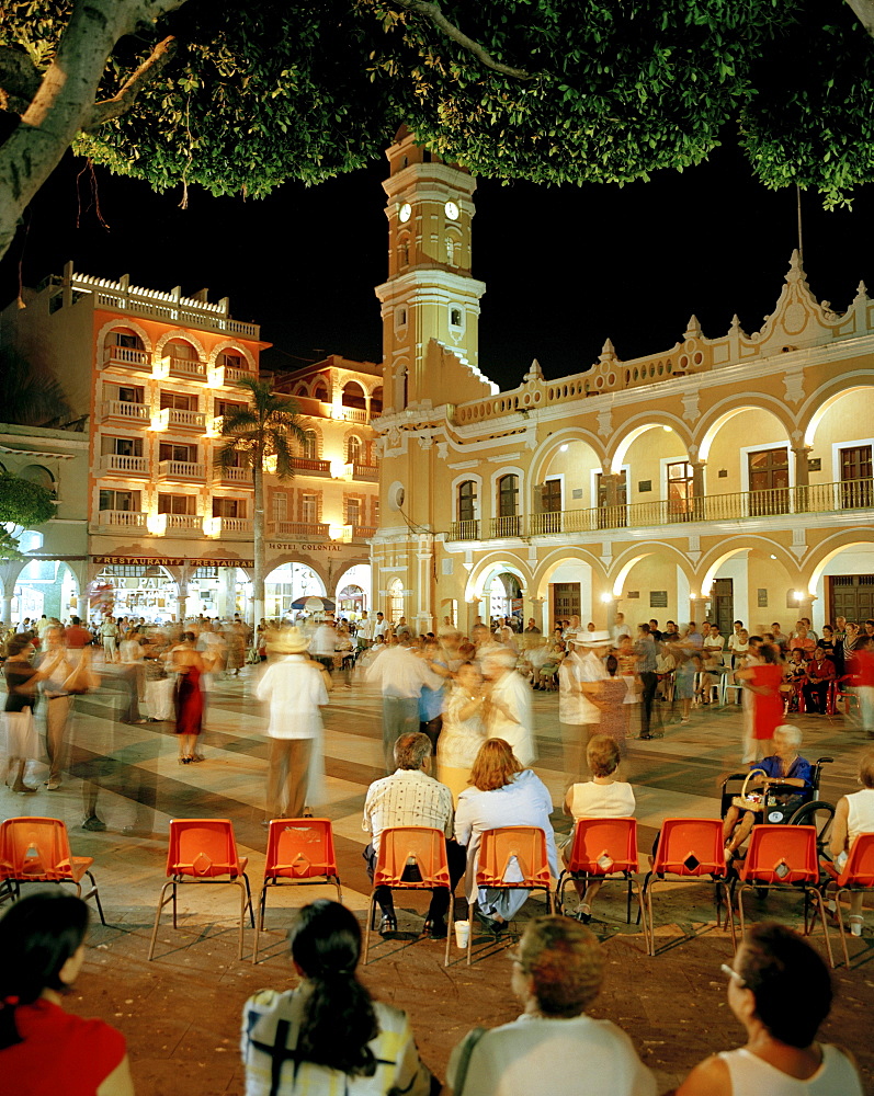 People dancing on the Zocalo in front of the town hall Palacio Municipal at the Old Town in the evening, Veracruz, Veracruz province, Mexico, America