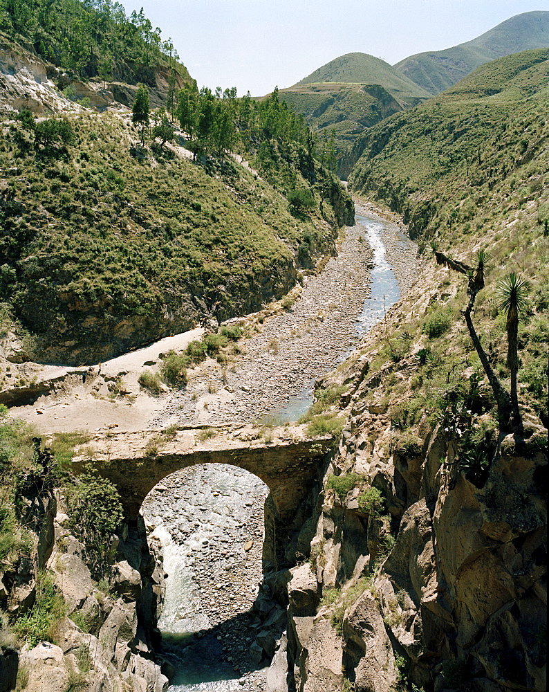 View at decayed stone bridge above Rio Apulco, Puebla province, Mexico, America