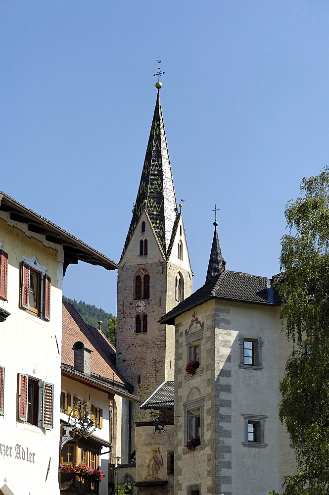 Houses and steeple of the village Villanders under blue sky, Villanders, Valle Isarco, South Tyrol, Italy, Europe