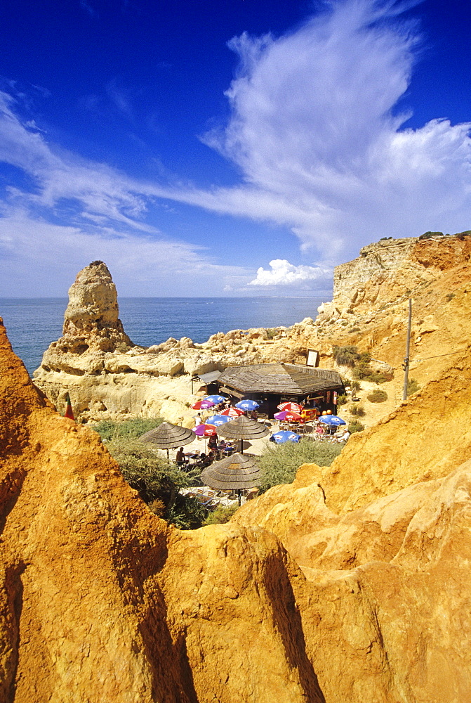 Beachside cafe between the rocks at the coast, Algar Seco, Algarve, Portugal, Europe