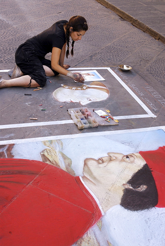 Street artist painting with chalk at Mercato Nuevo, Florence, Tuscany, Italy, Europe