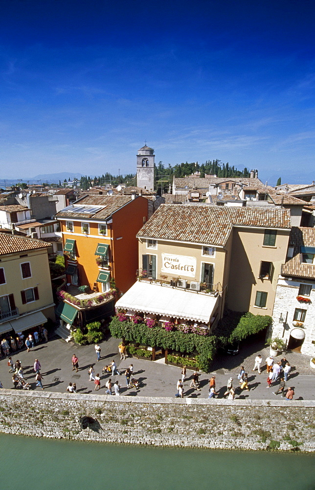 View at houses and people in the sunlight, Sirmione, Lake Garda, Lombardy, Italy, Europe