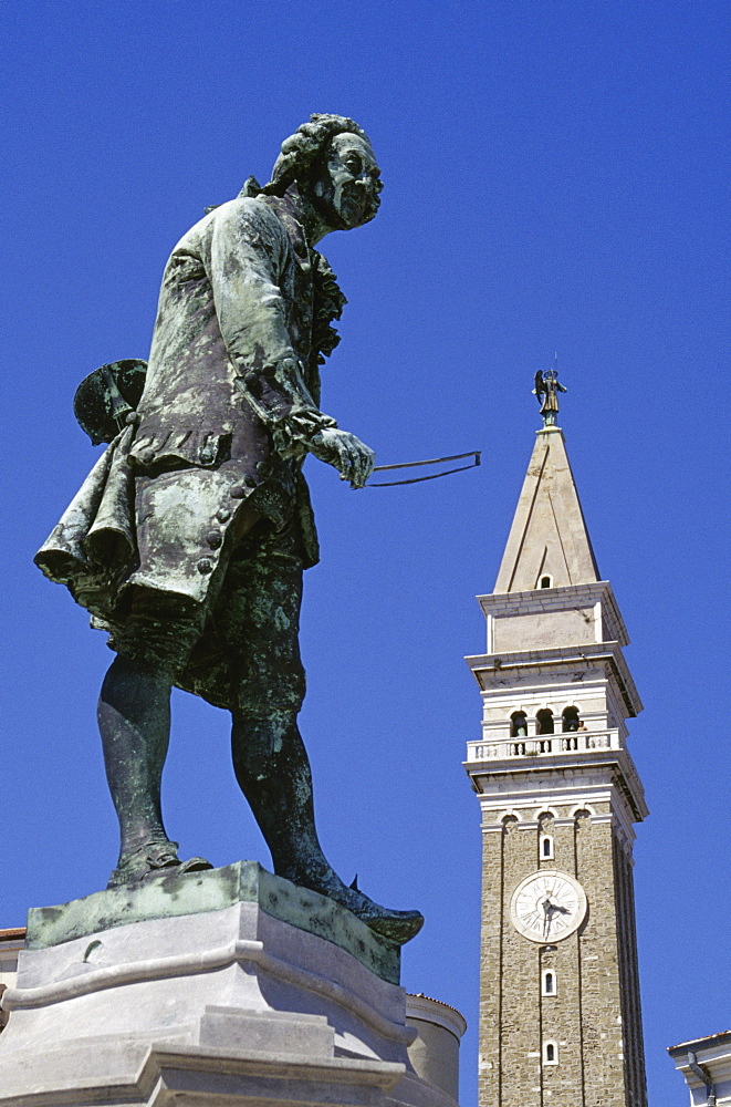 Tartini monument and St. George church under blue sky, Piran, Adriatic Sea, Istria, Slovenia, Europe