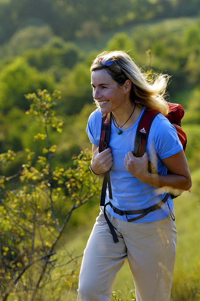 Woman with rucksack hiking at franconian Switzerland, Bavaria, Germany, Europe