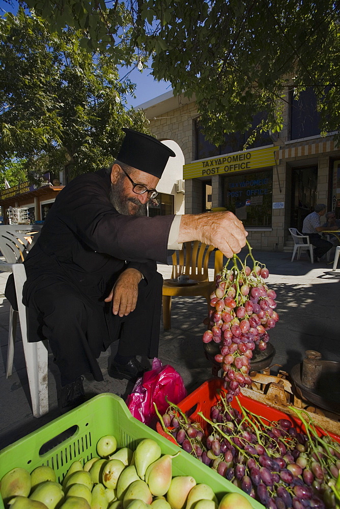 Monk, Priest selling fruit, Geroskipou, near Pafos, South Cyprus, Cyprus