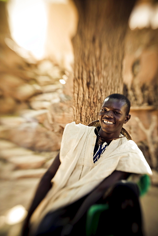 Laughing young man of the Dogon people, Falaise de Bandiagara, Mali, Africa