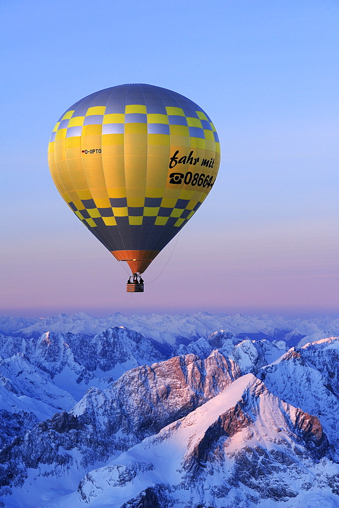 Aerial view of hot-air balloon flying above Alpspitze, Garmisch-Partenkirchen, Wetterstein range, Bavarian alps, Upper Bavaria, Bavaria, Germany, Europe