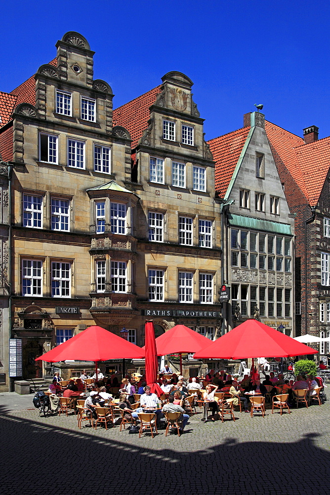 Historical houses and sidewalk cafes at the market square under blue sky, Hanseatic City of Bremen, Germany, Europe