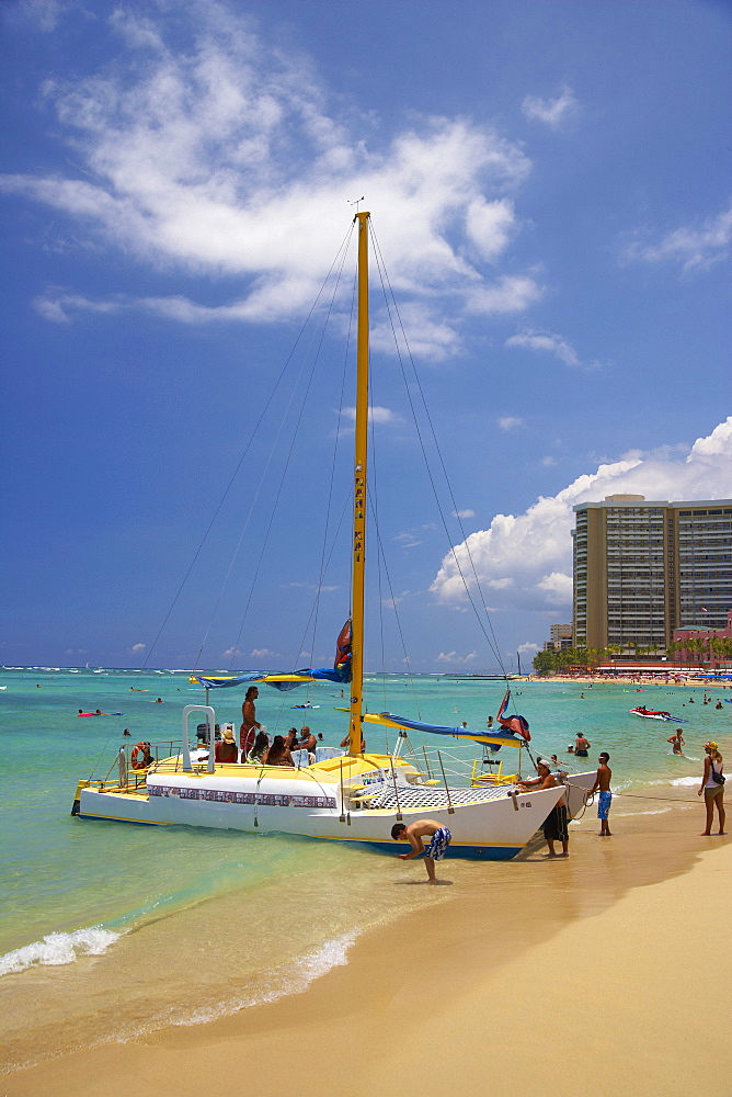 People and catamaran at Waikiki Beach, Honolulu, Oahu, Island, Hawaii, USA, America