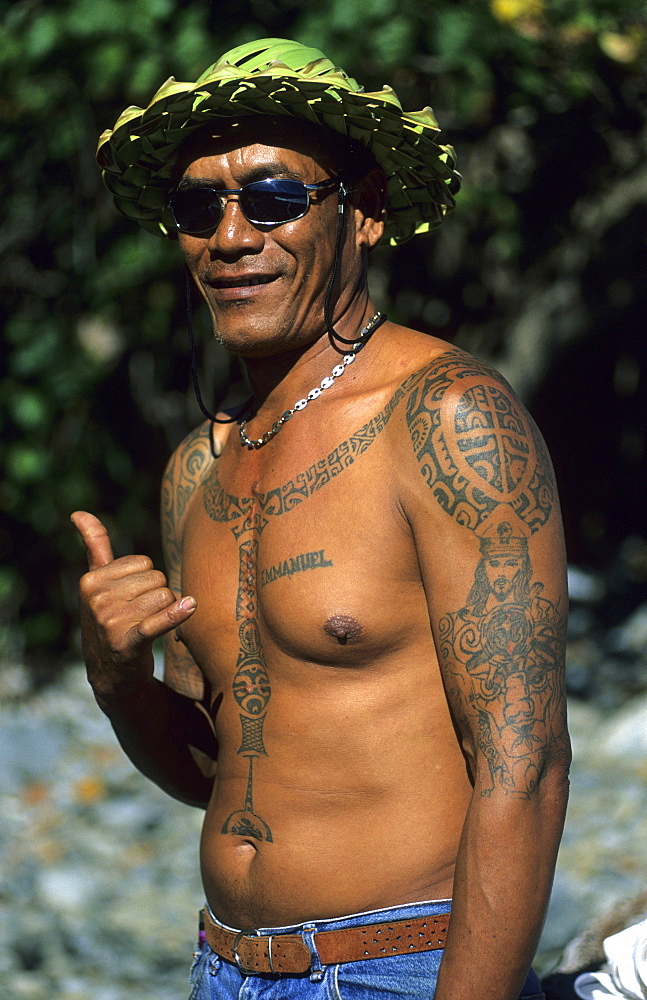 A Polynesian with traditional tattoos in the village of Hakahetau on the island of Ua Pou, French Polynesia