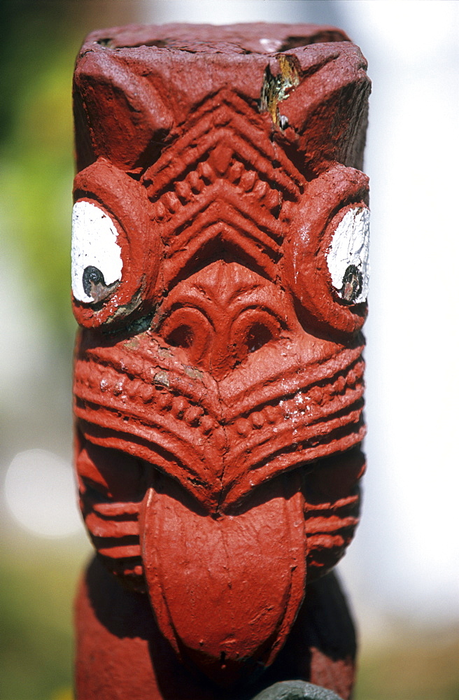 Wooden sculpture on a marea, a meeting place of the Maori in Rotorua, North island, New Zealand