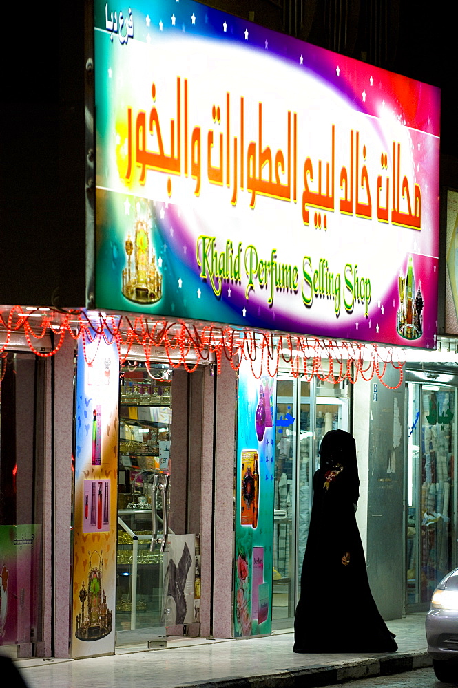 An Arabian woman with veil shopping, Perfumery, Rash al Khaimah, United Arab Emirates