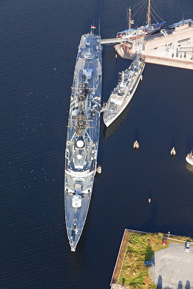 high angle, aerial view of a battleship in the naval base, harbour at Wilhelmshaven, Lower Saxony, Germany