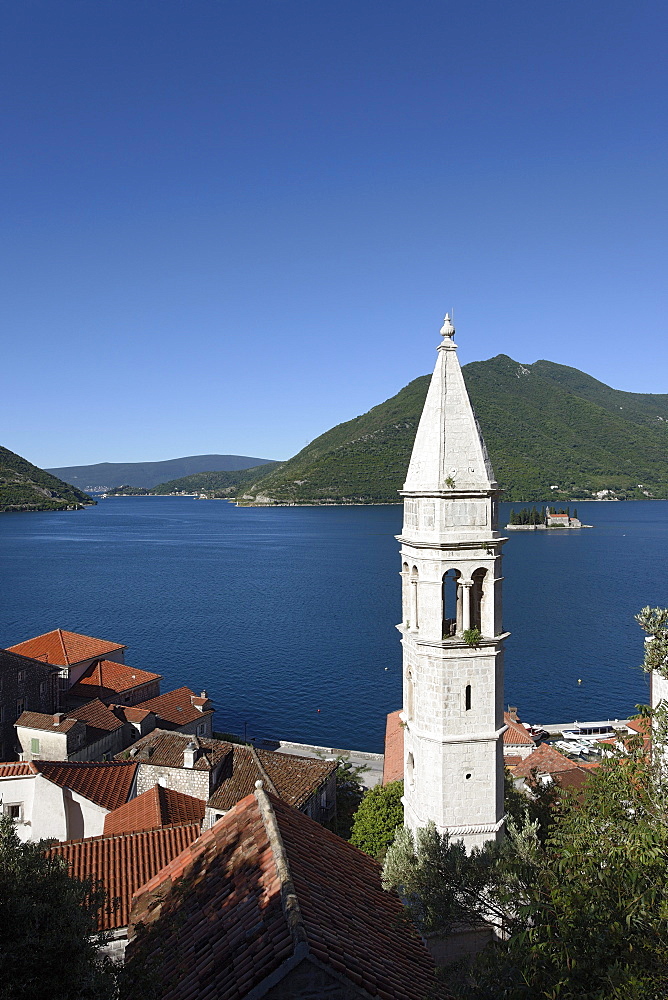 View of Sveti Nikola church with bell tower, in the background Gospa od Skrpjela island, Perast, Bay of Kotor, Montenegro, Europe