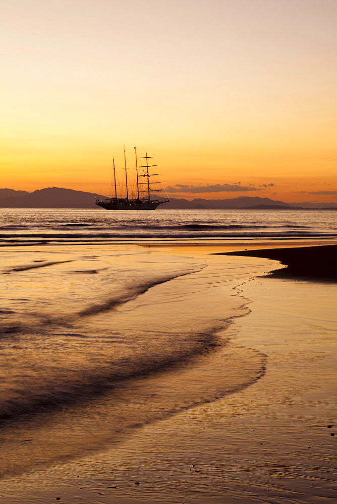 Beach and sailing cruiseship Star Flyer (Star Clippers Cruises) at sunset, Puerto Caldera, Puntarenas, Costa Rica, Central America, America