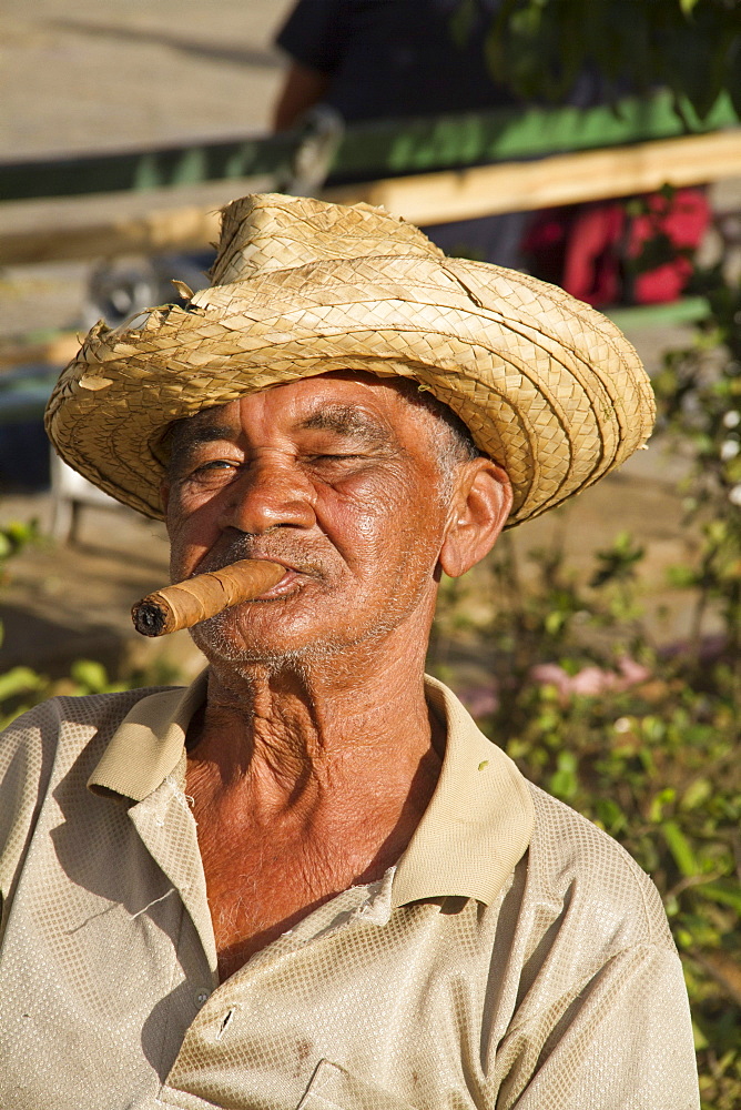 Old Man with cigar in front of village church, Vinales Valley, Province Pinar del Rio, Cuba, Greater Antilles, Antilles, Carribean, West Indies, Central America, North America, America