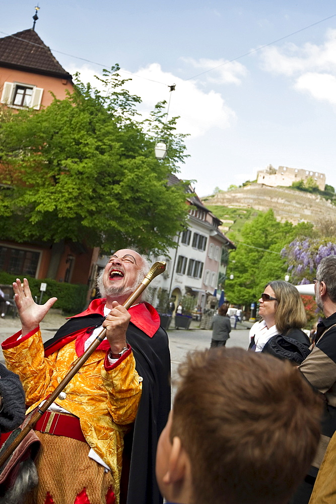 Disguised tourist guide with group of tourits, Staufen, Baden-Wuerttemberg, Germany, Europe