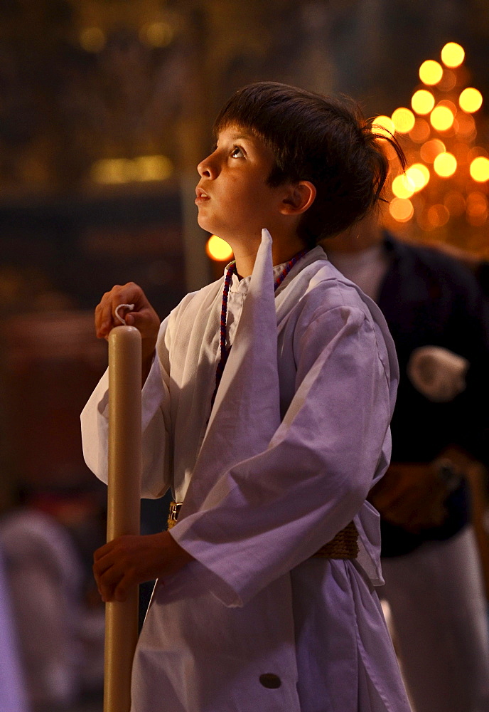 Boy in white cowl at the church El Salvador on Palm Sunday, Brotherhood La Borriquita, Semana Santa, Sevilla, Andalusia, Spain, Europe