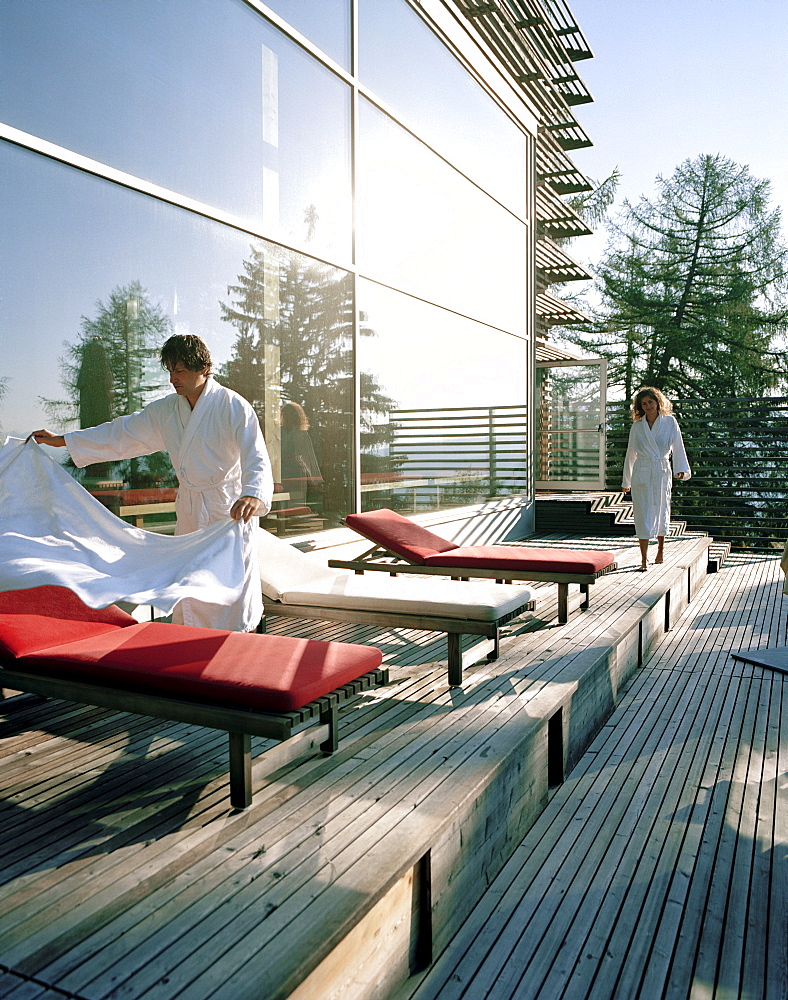 Hotel guests on sun deck, Vigilius Mountain Resort, Vigiljoch, Lana, Trentino-Alto Adige/Suedtirol, Italy