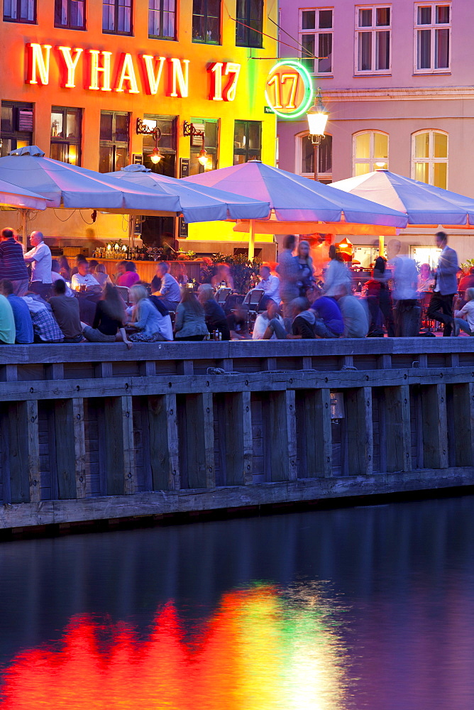 Cafes and restaurants in Nyhavn in the evening light, Copenhagen, Denmark