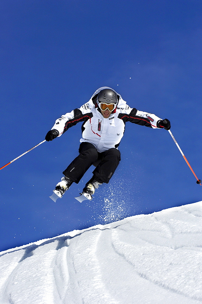 Skier going downhill, South Tyrol, Italy, Europe