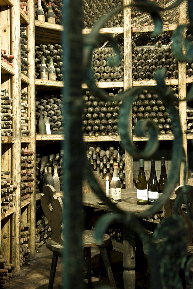 Dusty wine bottles at winery St. Pauls, Eppan an der Weinstrasse, Alto Adige, South Tyrol, Italy, Europe